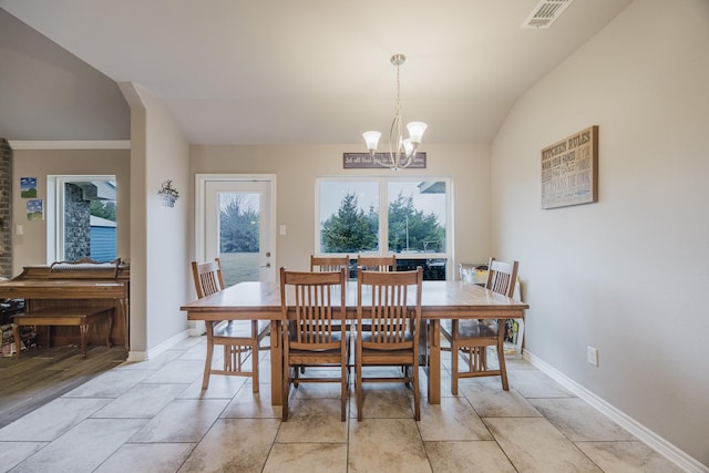 dining room with visible vents, baseboards, lofted ceiling, and an inviting chandelier