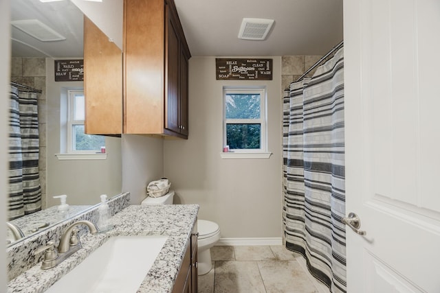 bathroom with visible vents, baseboards, toilet, a shower with shower curtain, and vanity