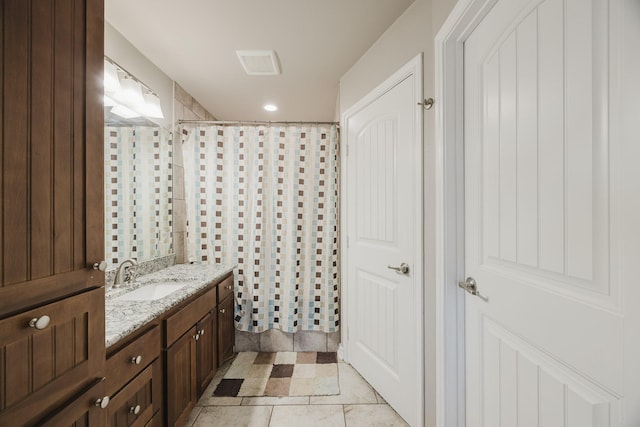 full bathroom featuring tile patterned floors, curtained shower, visible vents, and vanity