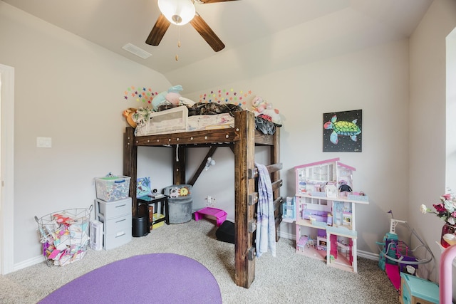 bedroom featuring visible vents, lofted ceiling, and carpet floors