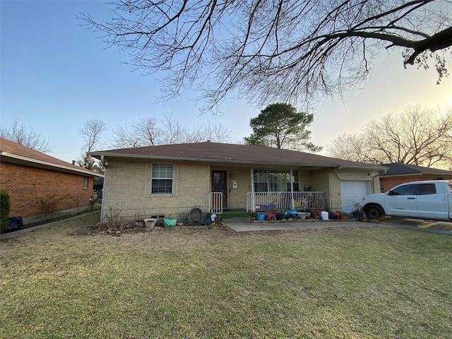 view of front facade with aphalt driveway, brick siding, a porch, an attached garage, and a front yard