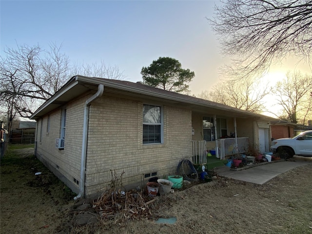 exterior space with crawl space and brick siding