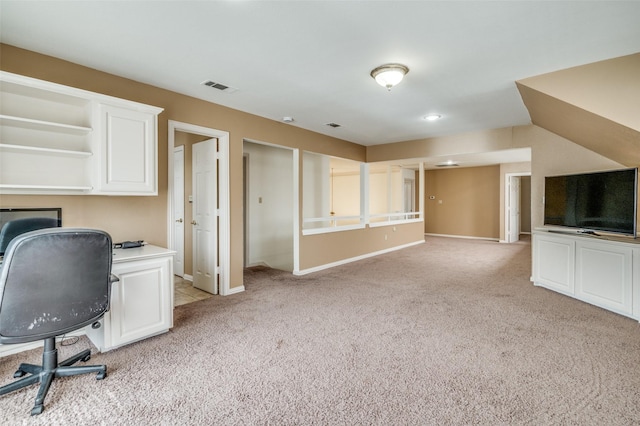 unfurnished office with light carpet, baseboards, and visible vents