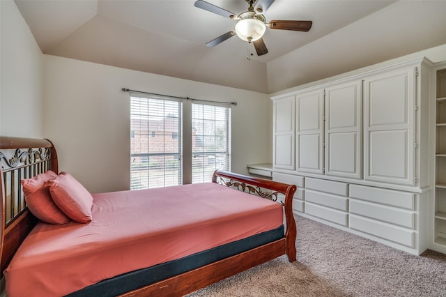 bedroom featuring carpet floors, vaulted ceiling, and a ceiling fan