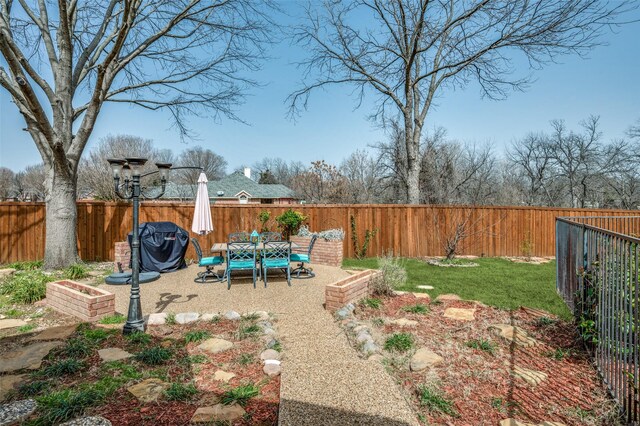 view of yard featuring a fenced backyard and a vegetable garden