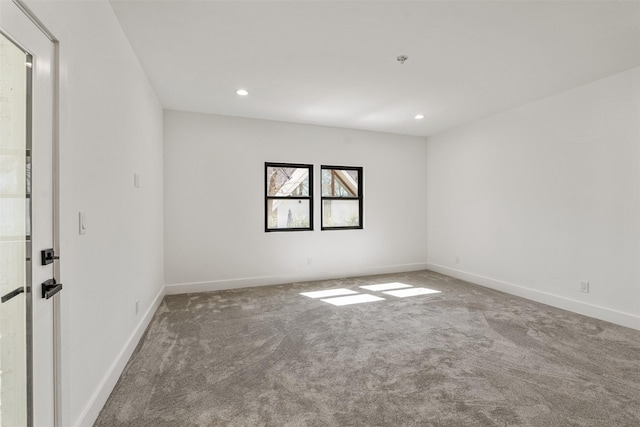 empty room featuring recessed lighting, baseboards, and carpet flooring