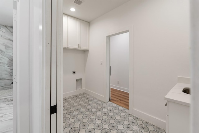 clothes washing area featuring visible vents, baseboards, recessed lighting, cabinet space, and electric dryer hookup