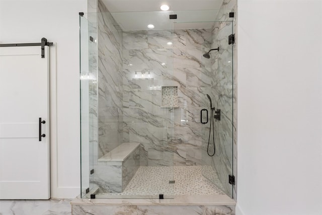 bathroom featuring recessed lighting, a marble finish shower, and marble finish floor