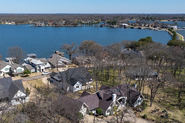 birds eye view of property with a residential view and a water view