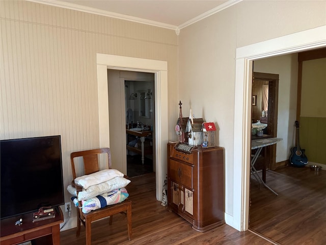 interior space featuring crown molding and wood finished floors