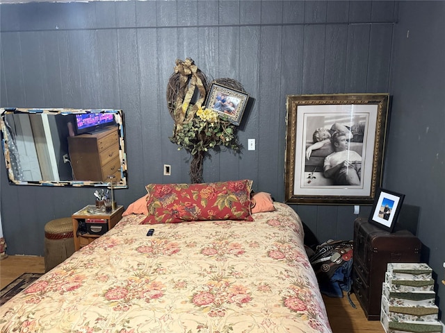 bedroom featuring wood finished floors