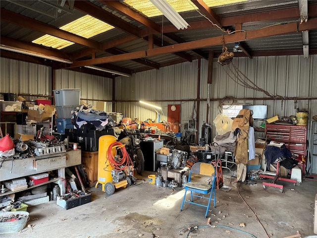 garage featuring a workshop area and metal wall