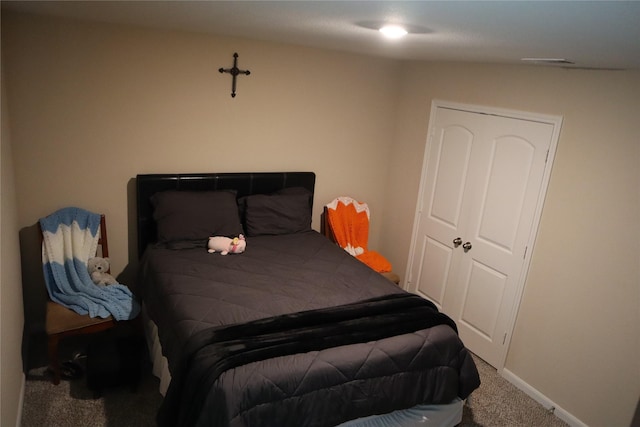 bedroom with carpet floors and baseboards