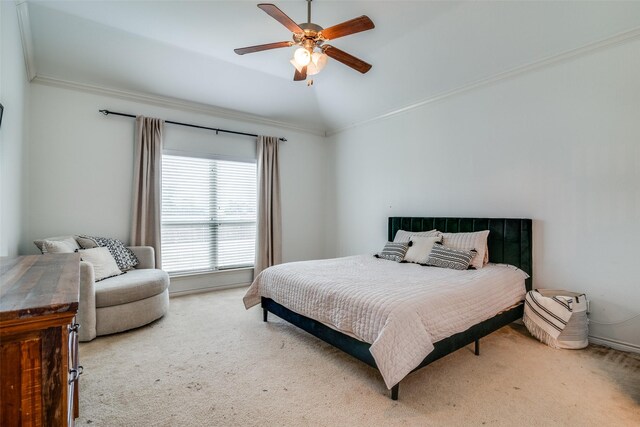 carpeted bedroom with ceiling fan, ornamental molding, and vaulted ceiling