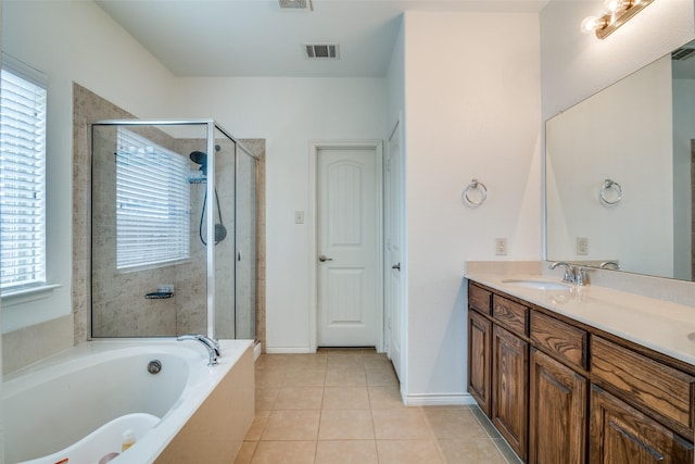 bathroom featuring a stall shower, visible vents, tile patterned flooring, vanity, and a bath