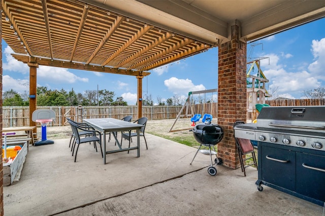 view of patio featuring a playground, outdoor dining space, a grill, a pergola, and a fenced backyard