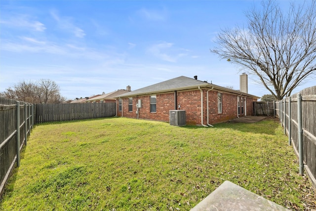 view of yard with a fenced backyard and cooling unit