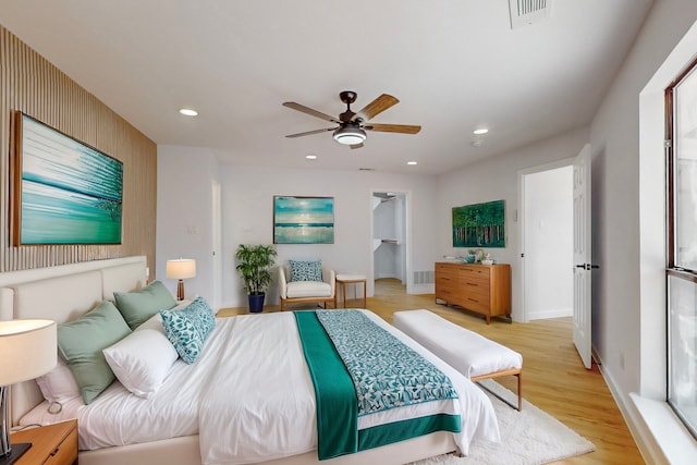 bedroom featuring visible vents, baseboards, ceiling fan, light wood-type flooring, and recessed lighting