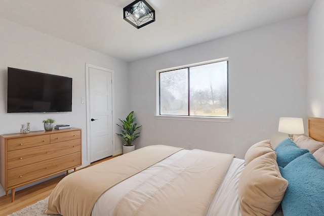 bedroom featuring light wood-style flooring