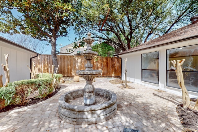 view of patio featuring fence