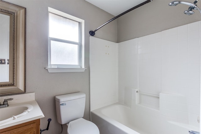 bathroom featuring bathing tub / shower combination, vanity, and toilet