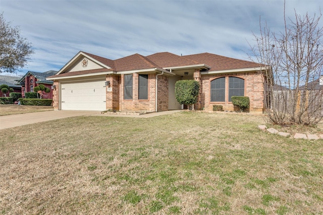 ranch-style house featuring an attached garage, brick siding, a shingled roof, concrete driveway, and a front yard