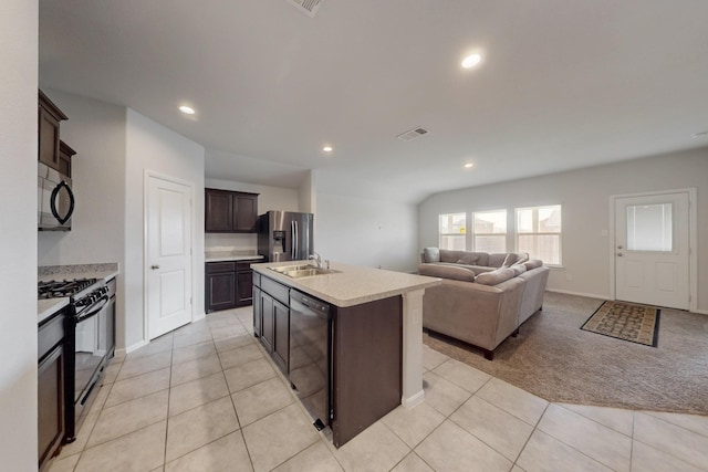 kitchen with visible vents, open floor plan, light countertops, black appliances, and a sink