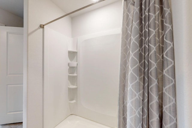 bathroom with curtained shower