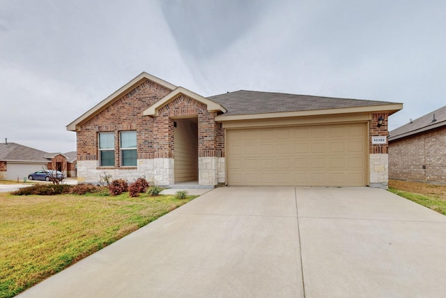 view of front of home featuring brick siding, a garage, stone siding, driveway, and a front lawn