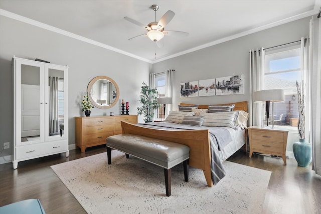 bedroom with dark wood-type flooring, multiple windows, and crown molding