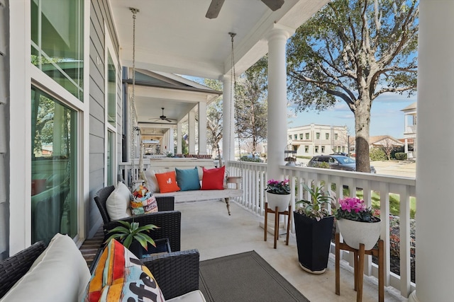 balcony featuring ceiling fan and an outdoor living space