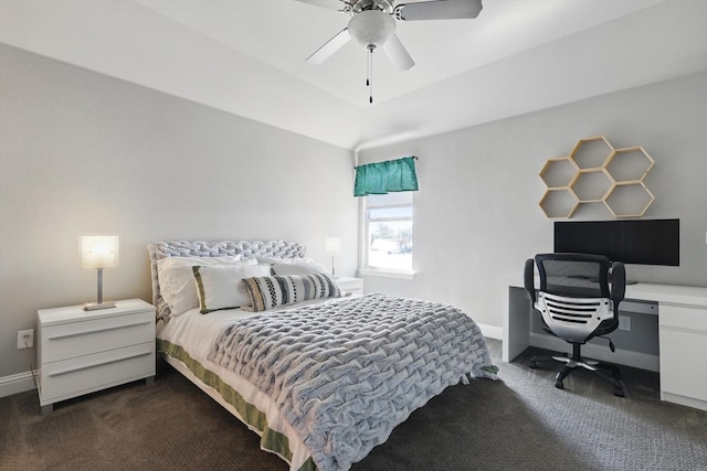 bedroom featuring ceiling fan, dark colored carpet, and baseboards