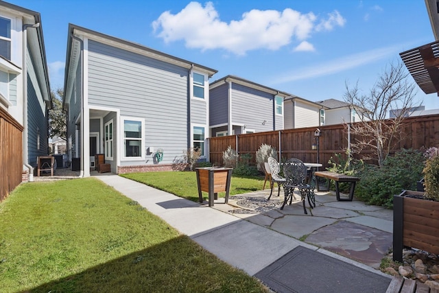 view of patio featuring fence