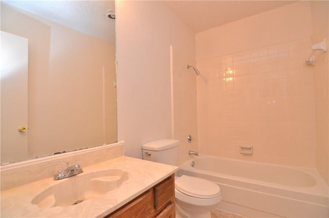 bathroom with washtub / shower combination, vanity, and toilet