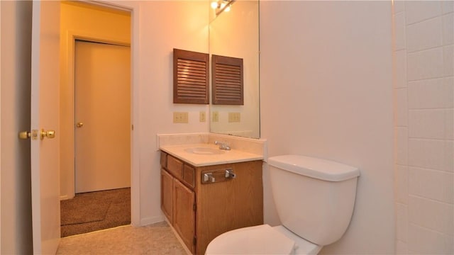 bathroom with toilet and vanity