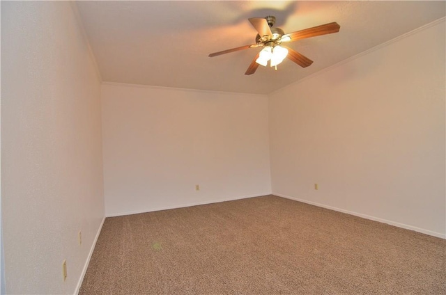 empty room featuring carpet, crown molding, baseboards, and ceiling fan