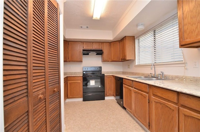 kitchen featuring light countertops, ornamental molding, a sink, under cabinet range hood, and black appliances