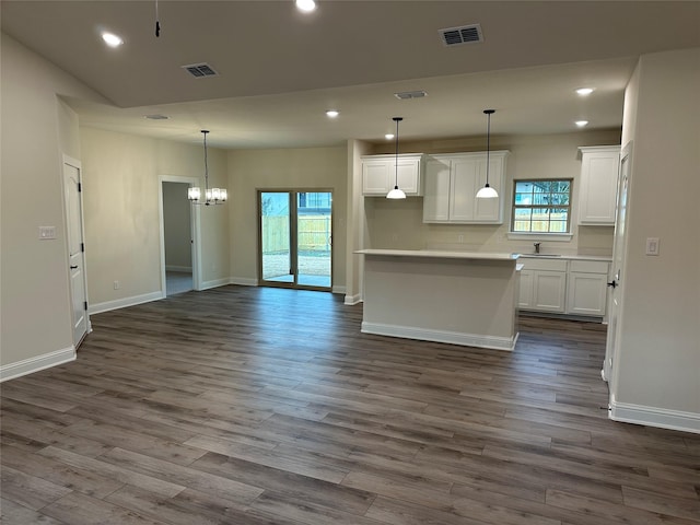 1727 Russell Dr, Garland, TX 75040 - kitchen featuring white cabinetry, dark wood-type flooring, baseboards, and recessed lighting