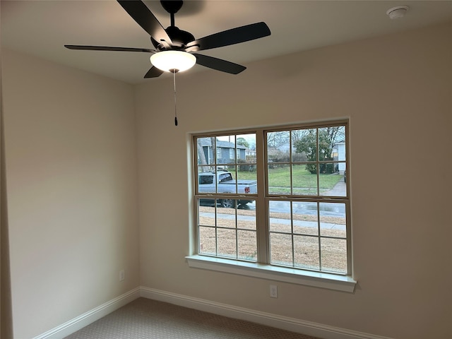 1727 Russell Dr, Garland, TX 75040 - carpeted empty room featuring baseboards, a smoke detector, healthy amount of natural light, and ceiling fan