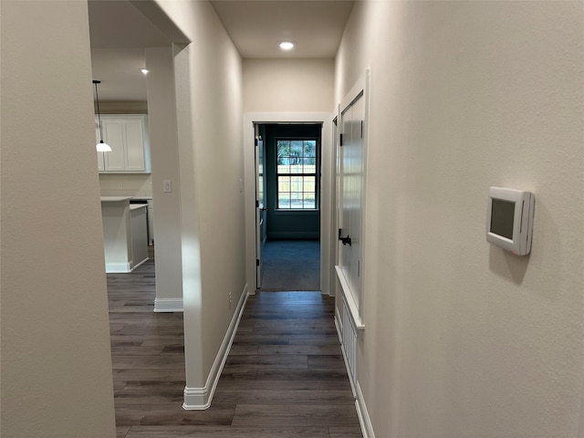 1727 Russell Dr, Garland, TX 75040 - hall featuring dark wood-type flooring and baseboards