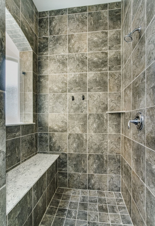 bathroom featuring tiled shower