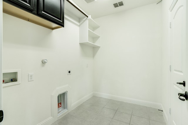 laundry room with cabinet space, visible vents, gas dryer hookup, hookup for a washing machine, and light tile patterned flooring