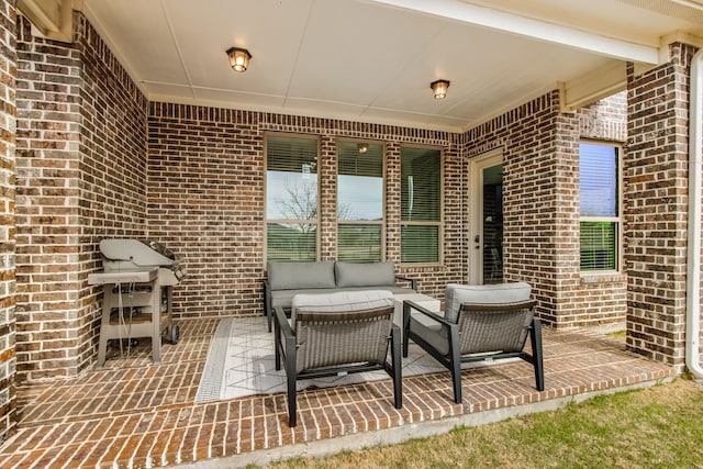 view of patio / terrace with a grill and an outdoor hangout area