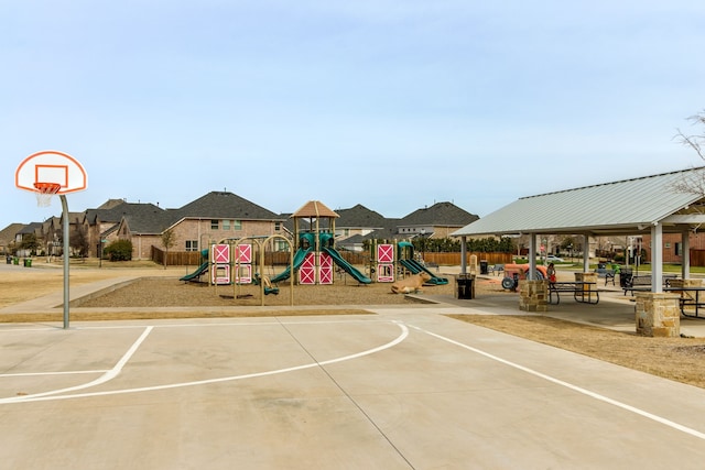 exterior space featuring a gazebo, fence, and a residential view