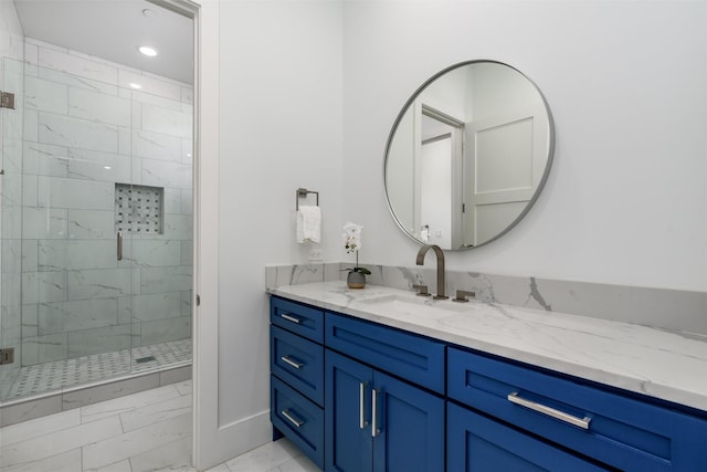 bathroom with recessed lighting, marble finish floor, a stall shower, and vanity