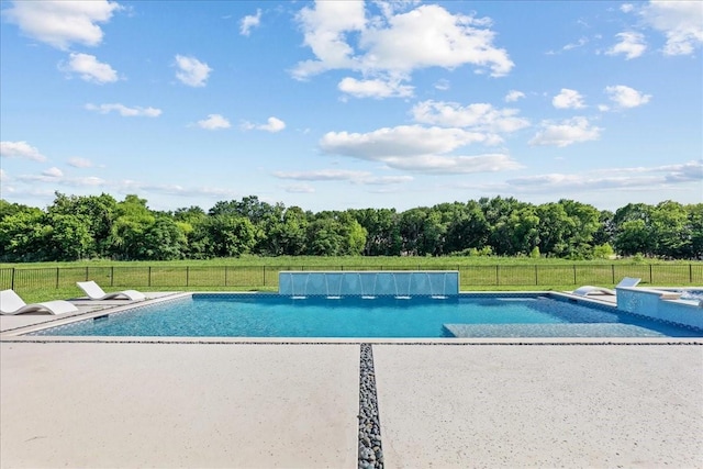 view of pool with a patio, a yard, fence, and a fenced in pool