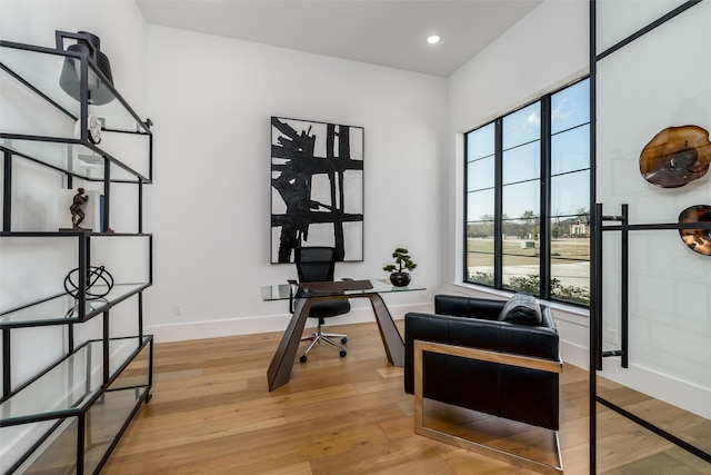 home office with recessed lighting, baseboards, and light wood-style floors