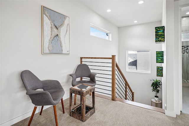 living area featuring carpet flooring, recessed lighting, an upstairs landing, and baseboards