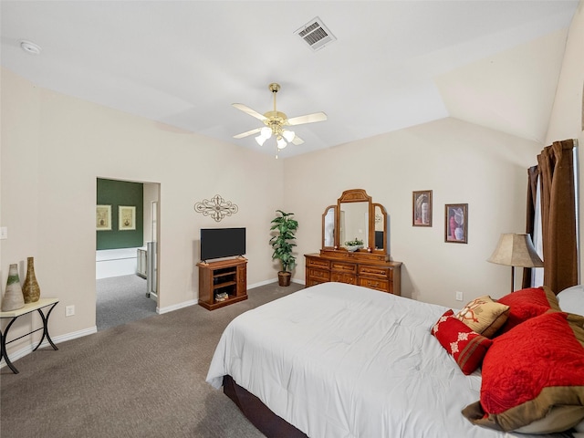 carpeted bedroom with visible vents, ensuite bathroom, a ceiling fan, vaulted ceiling, and baseboards