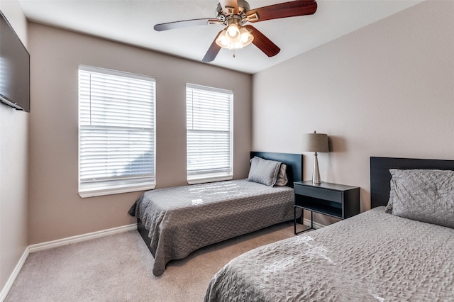 bedroom with carpet, ceiling fan, and baseboards